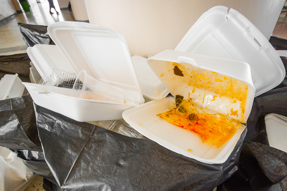 Food packages in a trash can