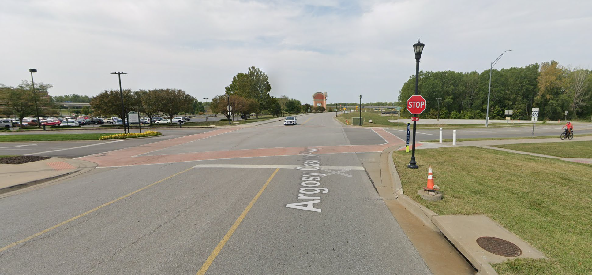 Bicyclist riding on the sidewalk in the city of Riverside, Missouri