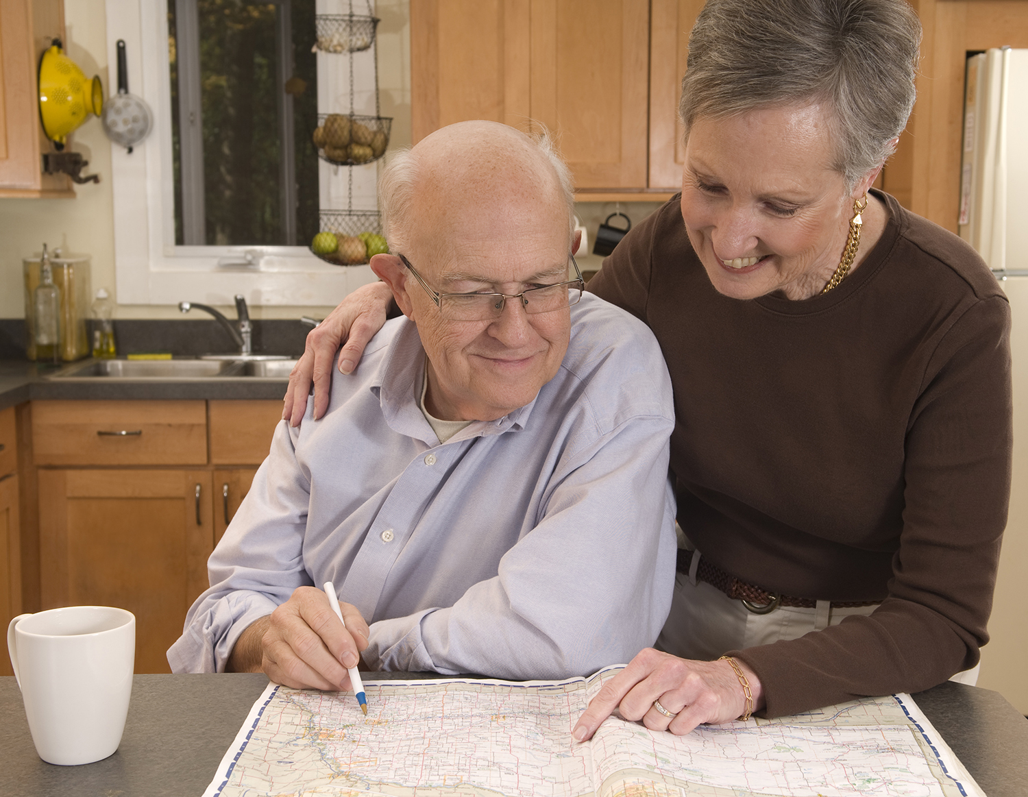 Two older adults completing a plan