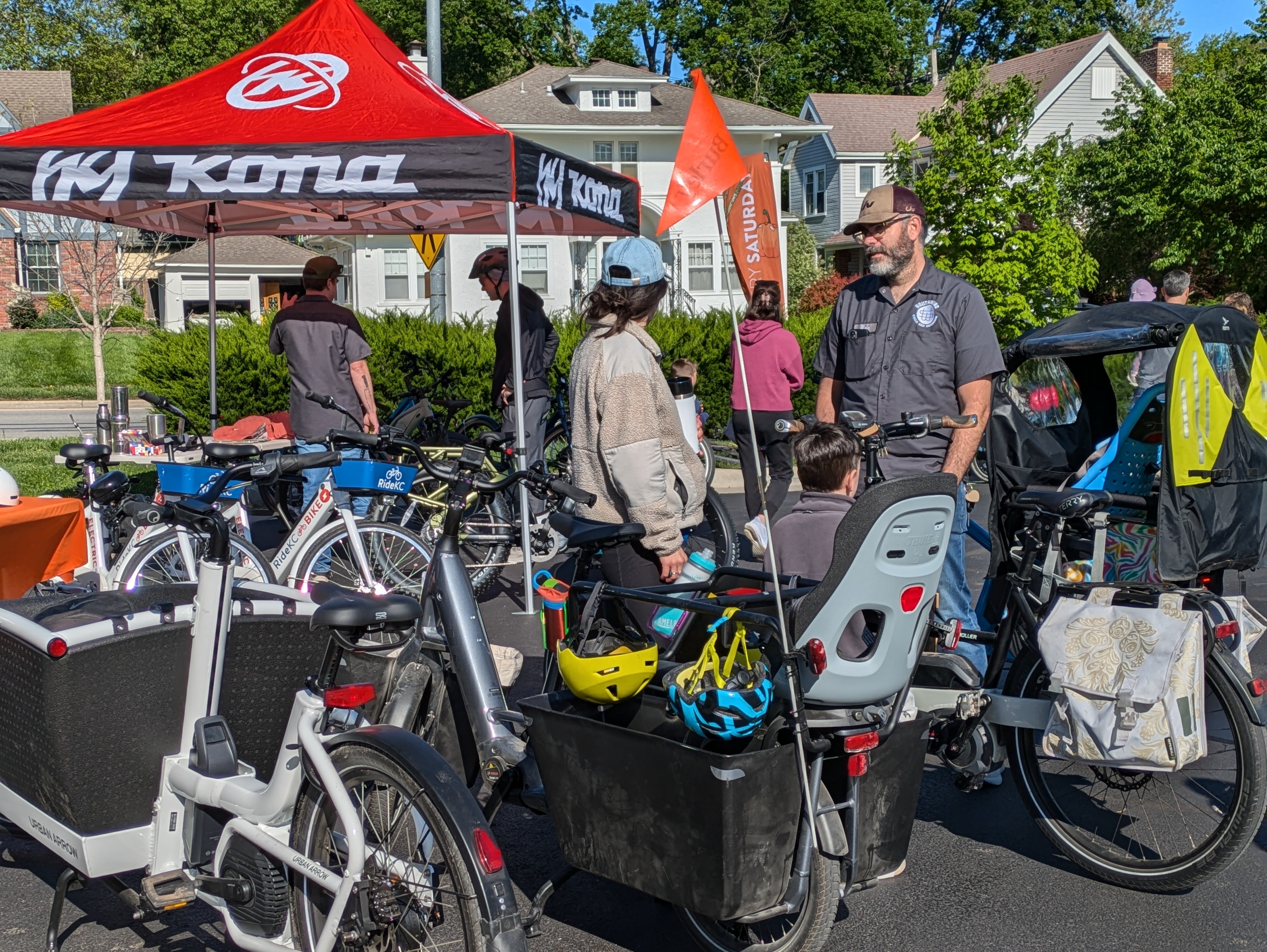 People looking at e-bikes during the E-Bike Petting Zoo