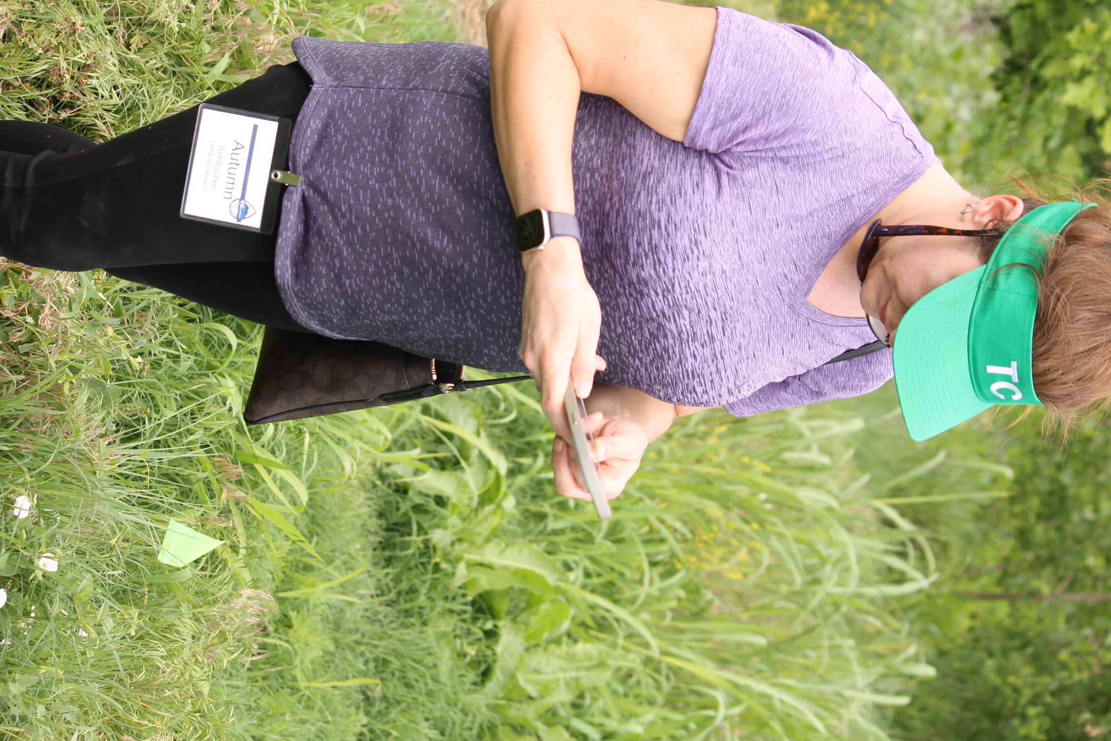 Participant uses smartphone application to differentiate undesirable weeds from invasive species.