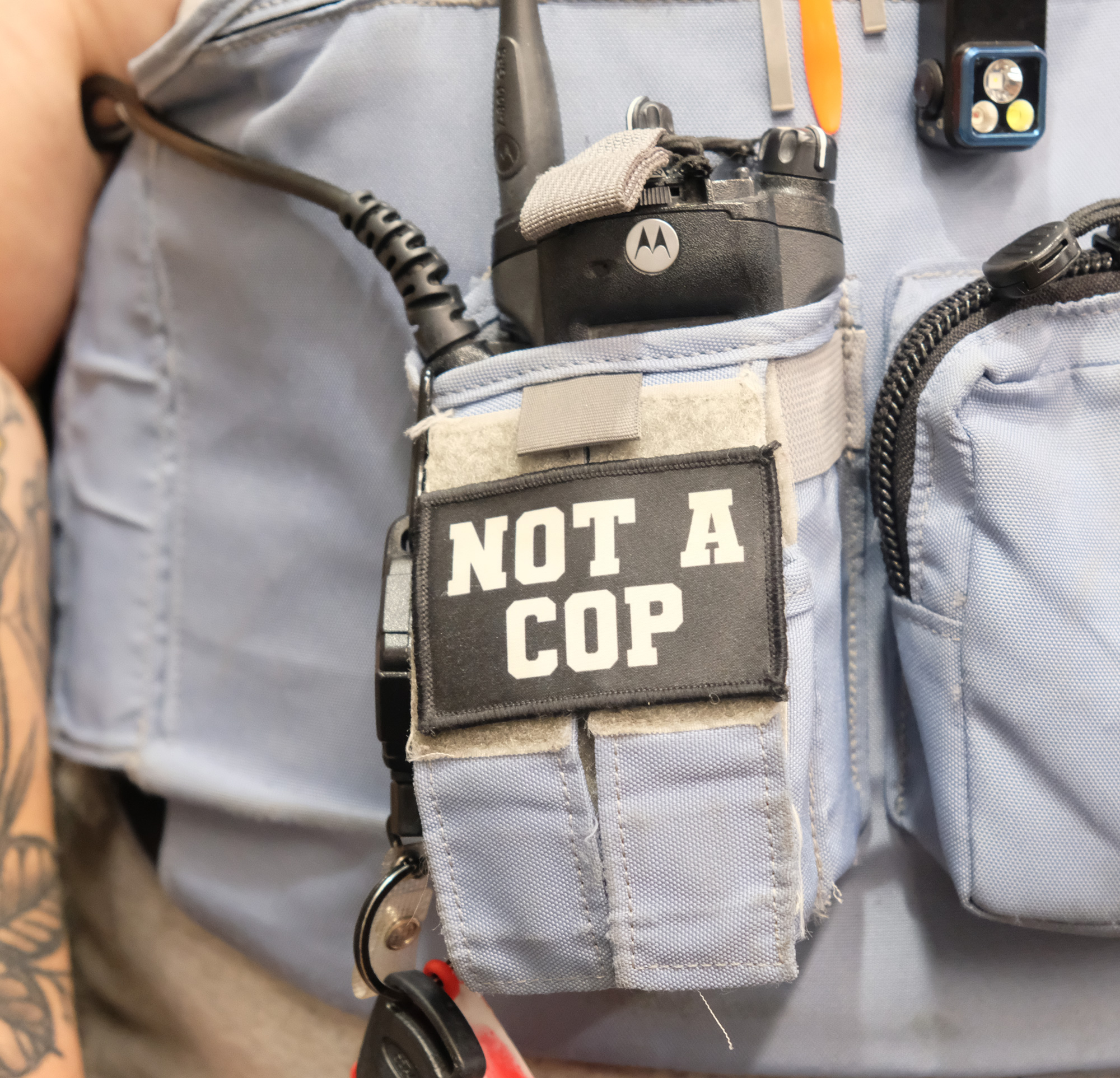 Lee's Summit, MO, co-responder wears patch on her vest that says "not a cop."
