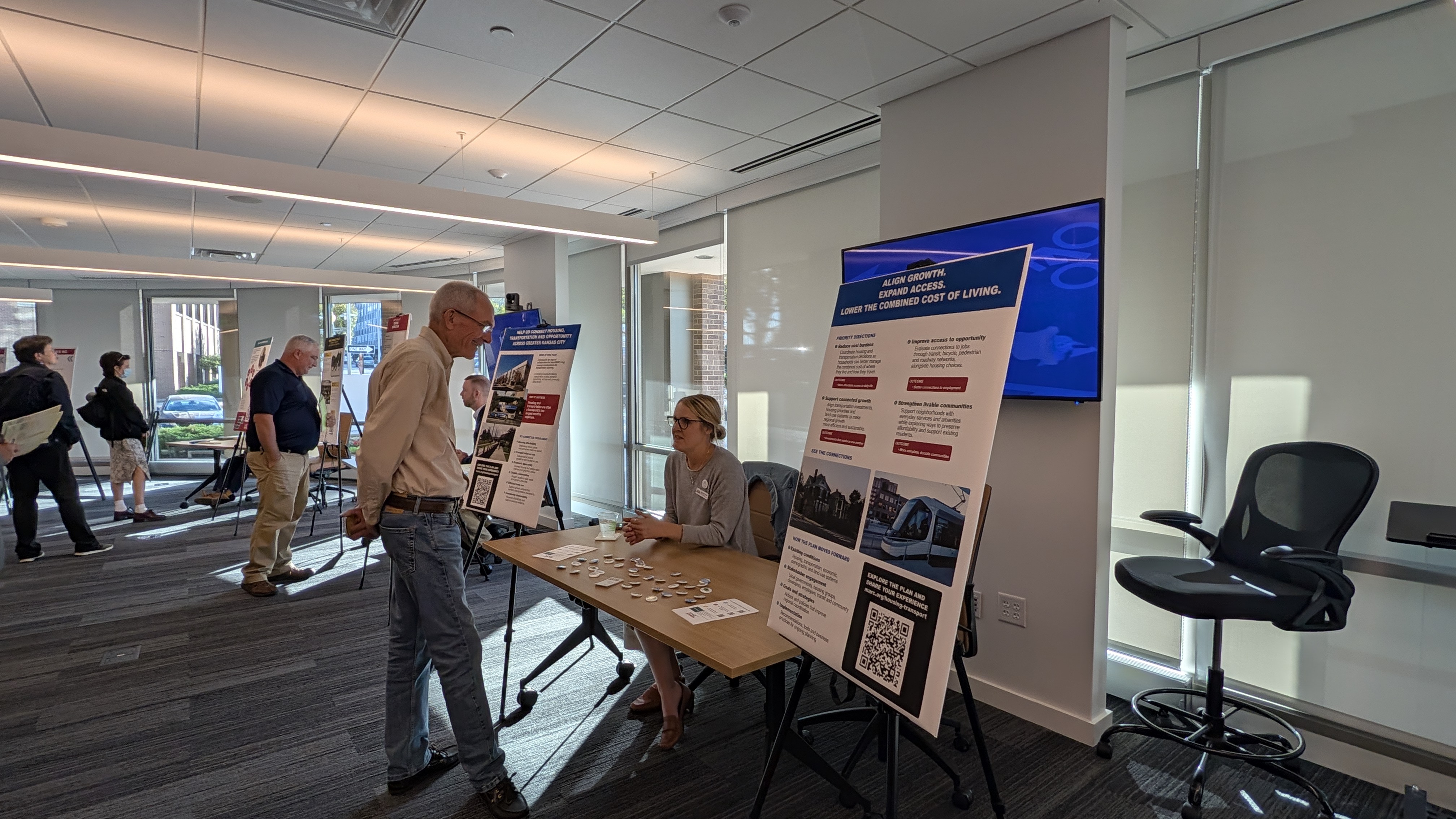 People taking survey at the Transportation & Environment open house