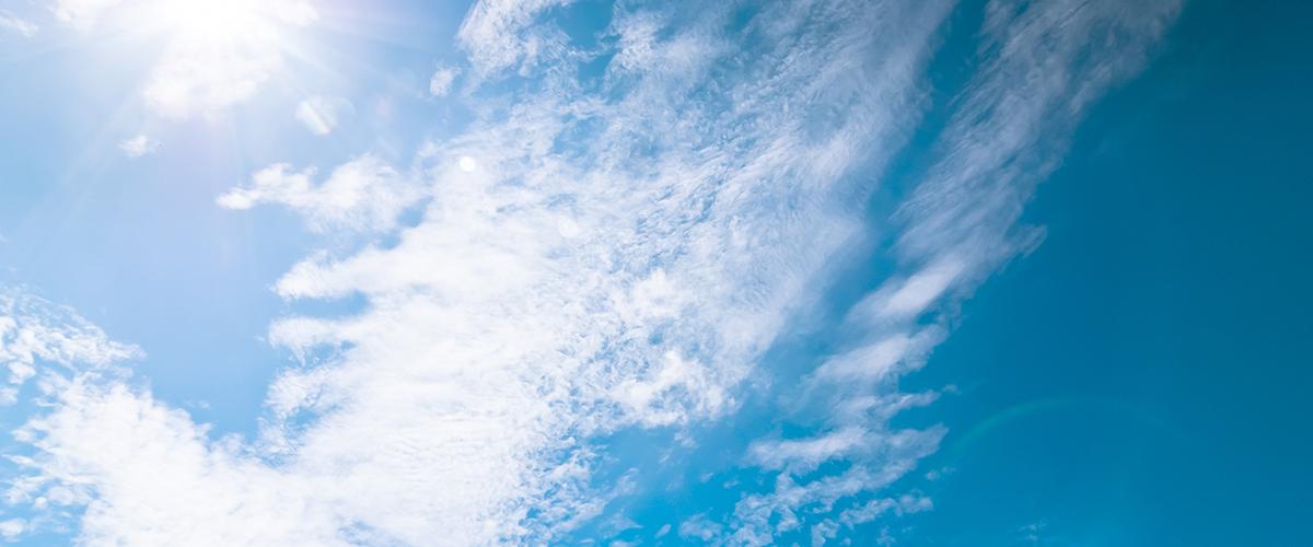 Sunny blue sky with light clouds
