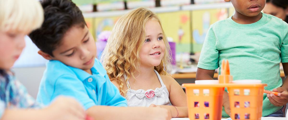 Students doing a project in a preschool classroom