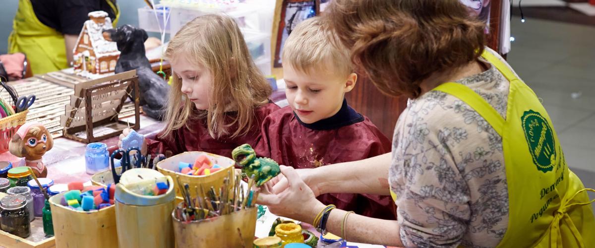 Children with teacher in preschool