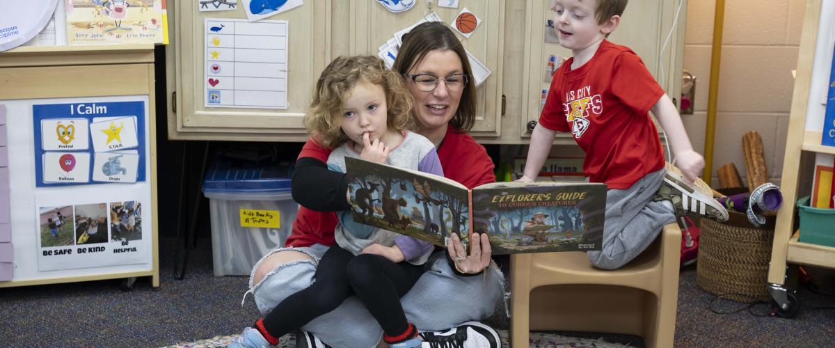 A MARC Head Start teacher reads to children