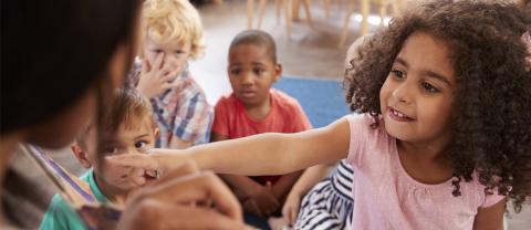 Group reading a story in an early education classroom