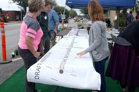 People reviewing street map