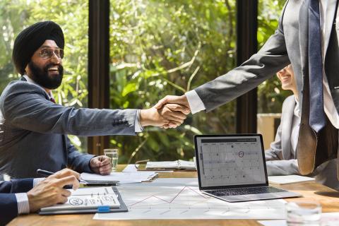 Shaking hands during a business meeting