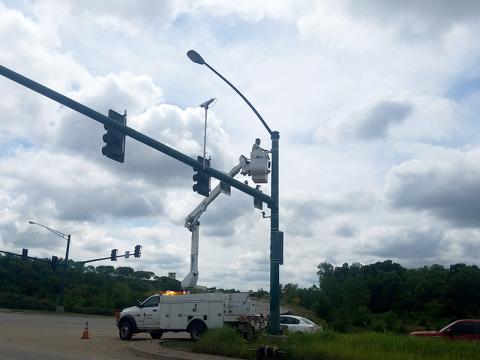 Bucket truck repairing traffic signal