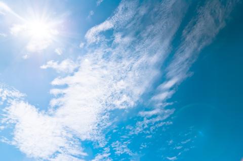 Sunny blue sky with light clouds