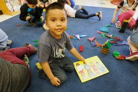 Head Start student with a puzzle 