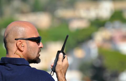 Man with handheld radio