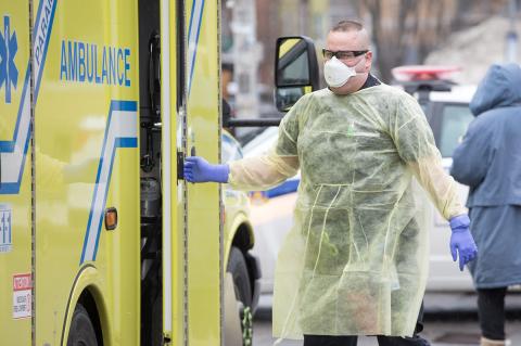 Medical professional outside an ambulance