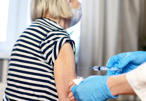 Older adult receiving a vaccine