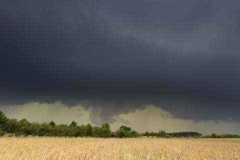 Tornado near an open field