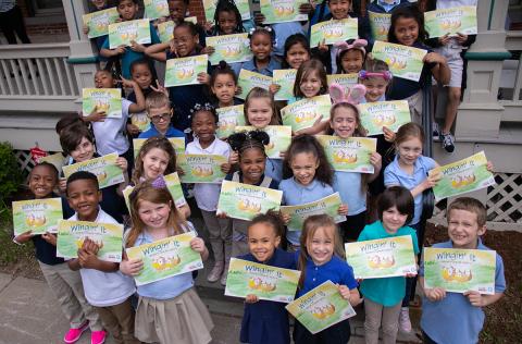 Students with Wingin' It book promoting air quality 