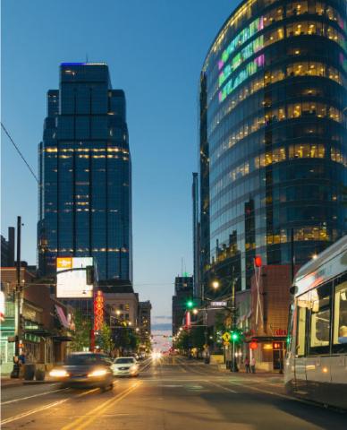 Downtown street with lights, cars and building