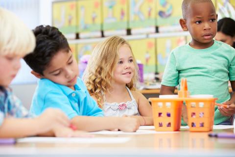 Students doing a project in a preschool classroom