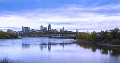 Skyline view of downtown Kansas City, Missouri with river in foreground