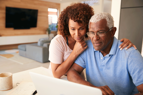 couple using laptop to access internet