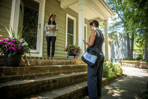 2020 Census worker talks with a resident about completing the questionnaire. 