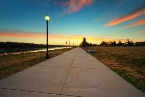 A walking path leads toward the Bond Bridge in Kansas City, Missouri.