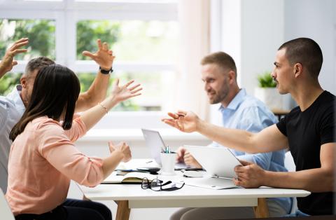 A group working together and looking frustrated
