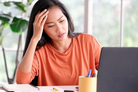 Stressed woman at a computer