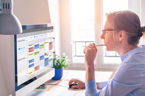 Woman viewing a digital calendar