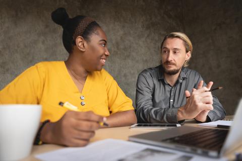 A woman and a man working together