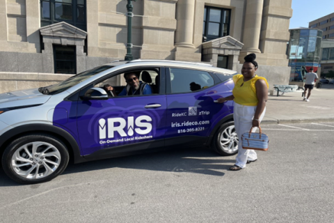 Person in front a Ride KC Iris car