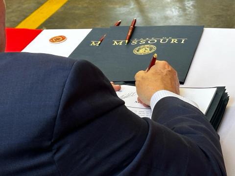 photo of Governor Parson signing Senate Bill 24 into law