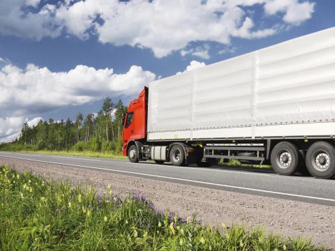 Freight truck traveling on road