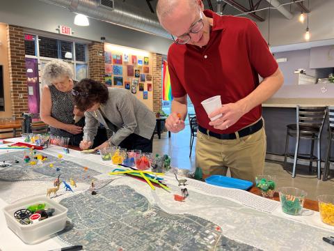 People looking at proposed ideas at an open house