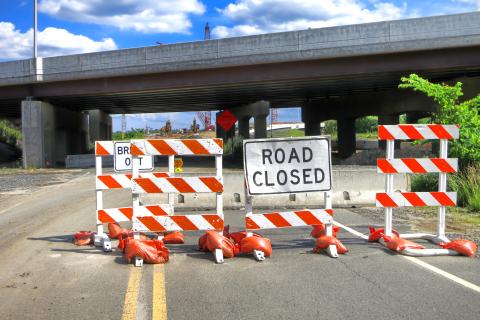 Road closed traffic sign on road