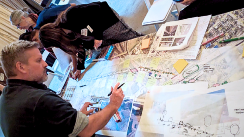 Participants mark up notes on plan blueprints for Southwest Boulevard