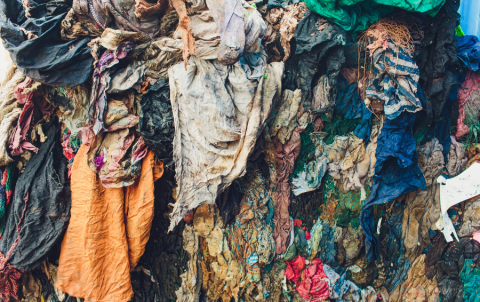 Clothes piled up in a landfill