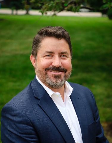 A portrait of Eric Mikkelson, mayor of Prairie Village