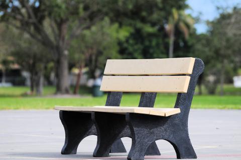 A bench made with recycled materials in a park