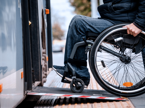 Wheelchair close-up person boarding bus
