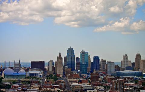 Kansas City skyline looking north, with a vibrant blue sky and white puffy clouds