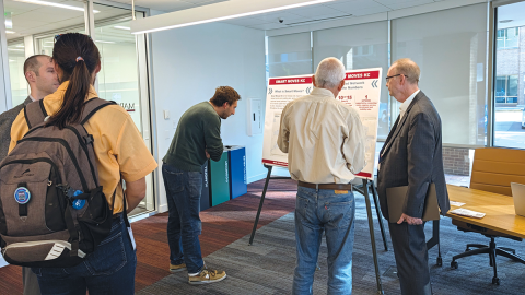 People looking at Smart Moves boards at the Transportation & Environment open house