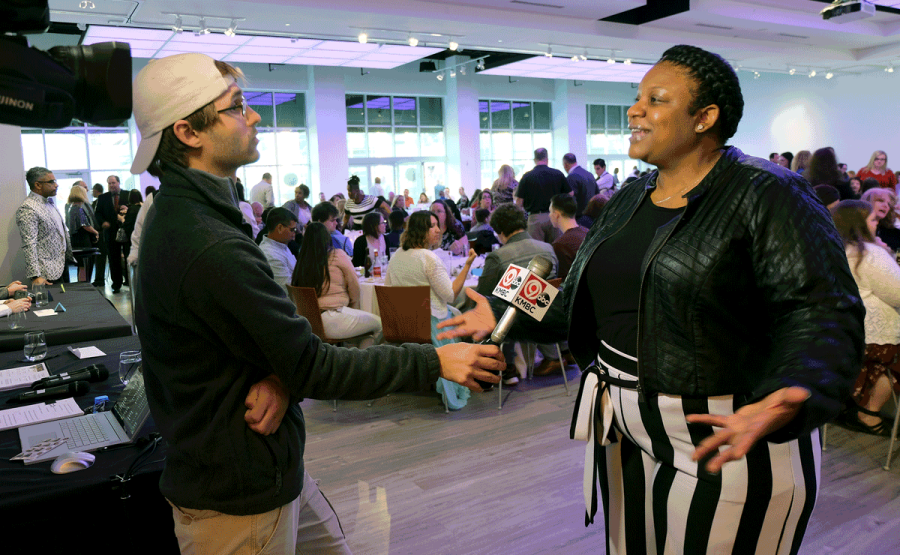 Tammy Poplar, recipient of the OPA Outstanding Individual Performance award, giving a television interview