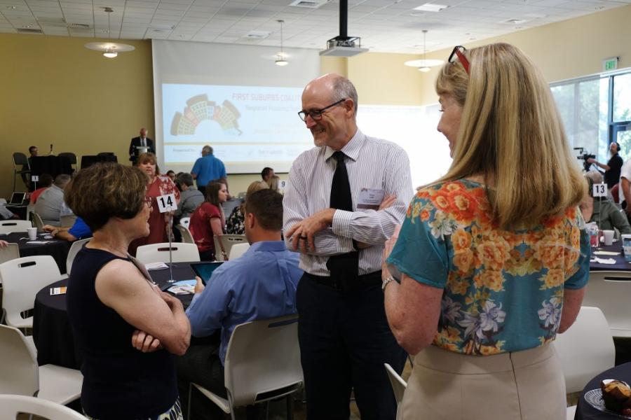 Regional Housing Summit attendees talking