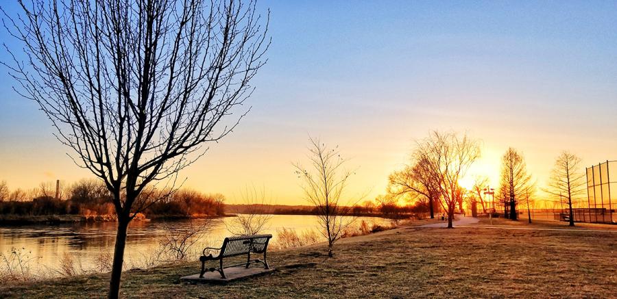 Sun setting in a park during winter