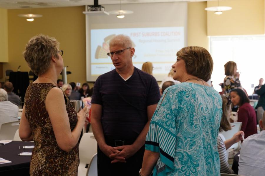 Regional Housing Summit attendees talking