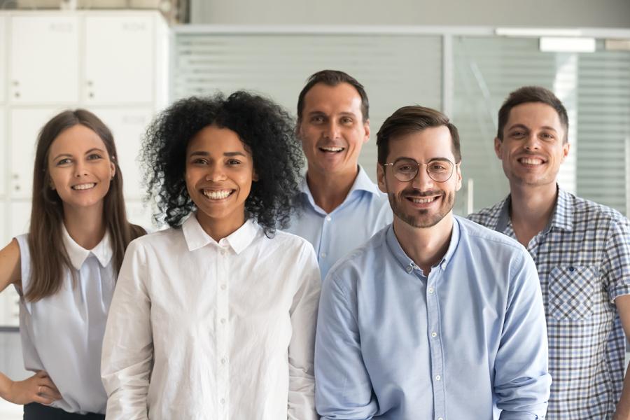 Group in business casual attire smiling