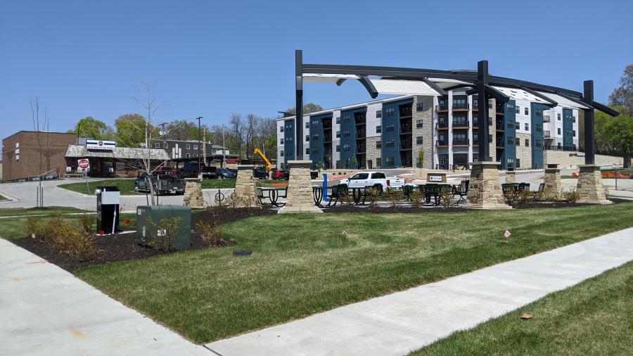 Multi use apartment building with sidewalk